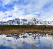 Denali Peeks reflecting in a lake