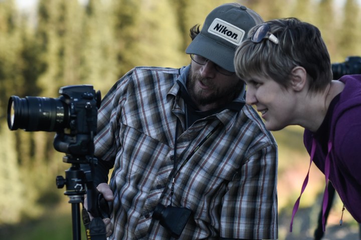 Photographer learning from a tour guide
