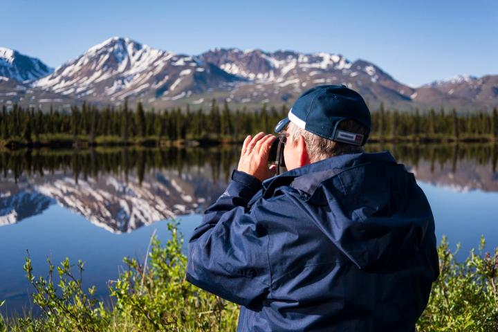 a man standing on top of a snow covered mountain