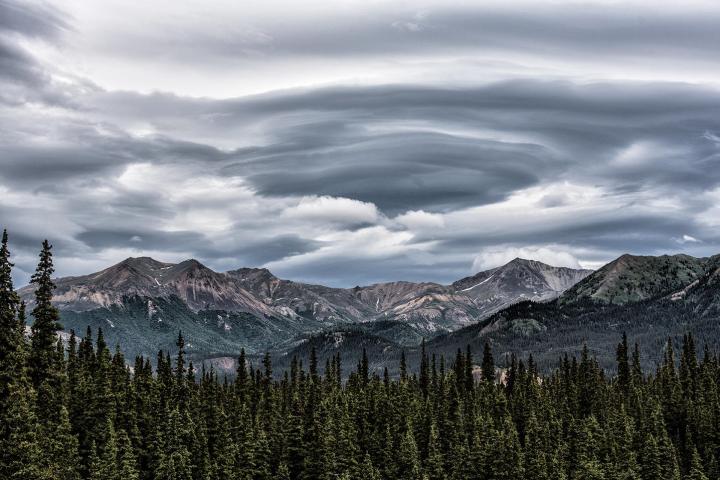 a group of people standing on top of a mountain